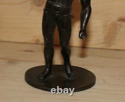 Antique hand made metal man athlete figurine