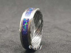 Damascus deep space opal glow ring. Damascus stainless steel opal inlay wedding