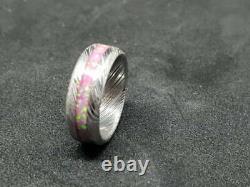 Damascus stainless steel wedding glow ring with hot pink opal inlay