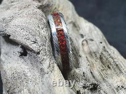 Helmskringla pattern Damascus steel ring with Ruby red opal, stainless steel dam